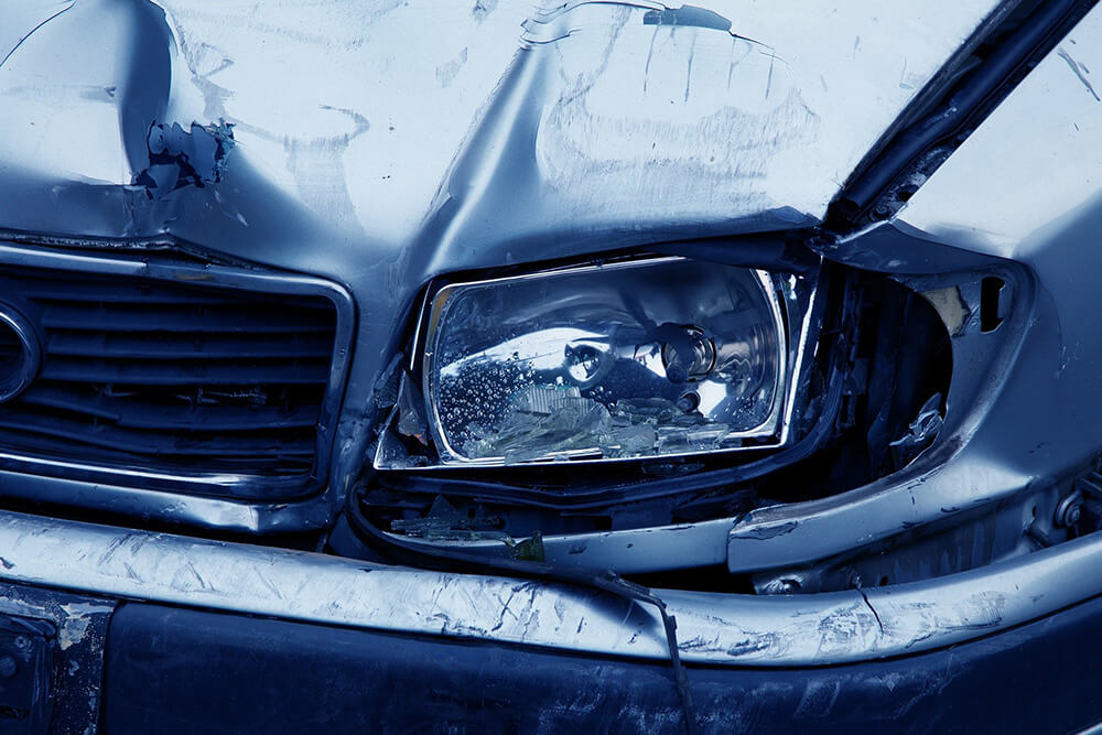 Smashed headlight on car